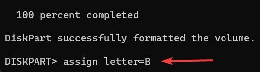 Назначение новой буквы USB-накопителю в командной строке.