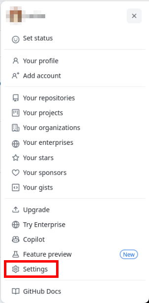 Снимок экрана, на котором показан параметр «Настройки» в меню профиля Github.