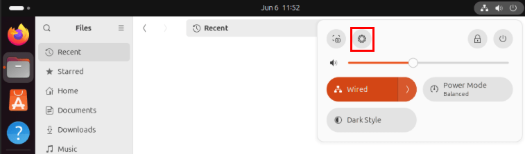 Снимок экрана, на котором выделен значок шестеренки на панели задач Ubuntu.
