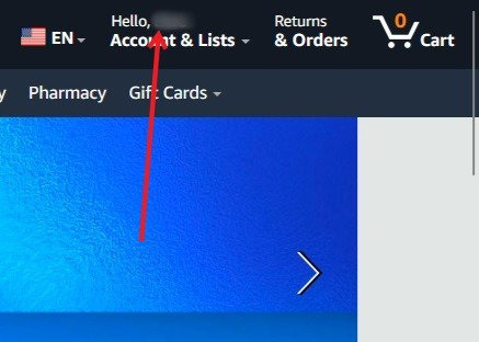 Нажав на свое имя в Amazon в веб-браузере.